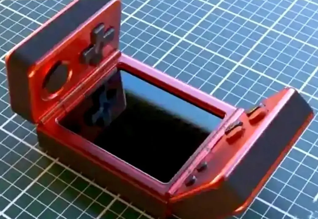 New clamshell gaming handheld concept shown with multiple foldable elements